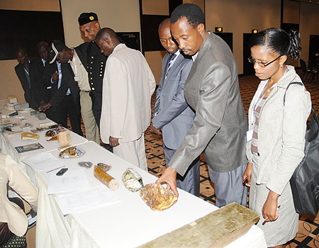 Guests and investors examine various mineral samples during the International Mines Day celebated in Kigali, Yesterday. The New Times /John Mbanda.