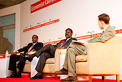 EAC Secretary General, Dr. Richard Sezibera (L) Primier Raila Odinga of Kenya (c), and Robert Adams of The Economist during the summit, yesterday in Kigali. The New Times /TKisambira.