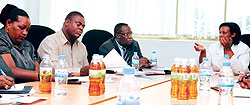 GMO chief Oda Gasinzigwa (R), talking to EALA  Members at her offices, yesterday. The New Times / Timothy Kisambira.