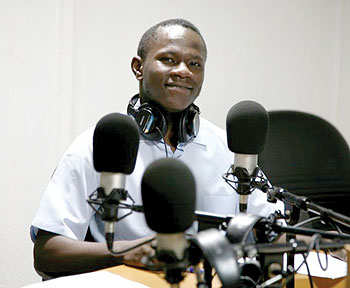 Cross Fire host Eugene Anangwe in the Contact FM radio studio. The New Times/Courtesy.