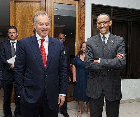 President Kagame and Tony Blair chat after their meeting at Village Urugwiro yesterday. The New Times / Village Urugwiro