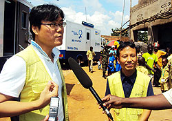 Managing-Director-of-Good-Neighbours-David-Sehyeon-Baek,(left)-speaks-to-reporters.-Photo-Sunday-Times-D.Sabiit
