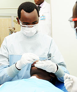 A-dentist-attends-to-a-patient.-American-volunteers-will-jet-into-the-country-early-next-year-to-boost-the--dental-healthcare.