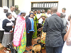 Needy women receive goats donated by the youth. The New Times/ S. Rwembeho.