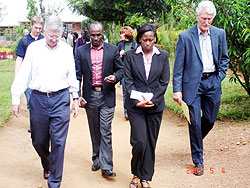 US Ambassador Donald Koran (L) and the management of Teachers' Training Centre tour the institute. 