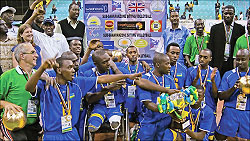 The national sitting volleyball team pose for a photo shortly after qualifying for next yearu2019s Paralympic Games in London. The New Times / File