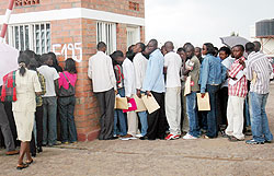Jobseekers line up to submit their applications. Government hopes to significantly cut unemployment rate in the near future. The New Times / File.