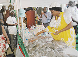 A Woman at a Jua Kali exhibition. Participants in the expo have decried high taxes. The New Times / file