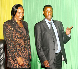 Defence Minister Gen. James Kabarebe (R) with Speaker Rose Mukantabana in Parliament (The New Times / John Mbanda).