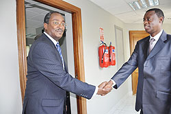 Defence Minister James Kabarebe (R) shakes hands with the new Sudanese Ambassador to Rwanda, Nasreldin Ahmed Walli after their meeting in Kigali yesterday.