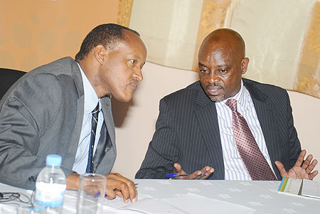 PSF Chairman Faustin Mbundu (L) with the Commissioner General of Rwanda Revenue Authority, Ben Kagarama at the forum yesterday . The New Times / J. Mbanda.
