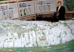 An investor looks at the City Master plan. The plan shows that a city centre will be built in Gahanga Sector in Kicukiro District. The New Times / File.