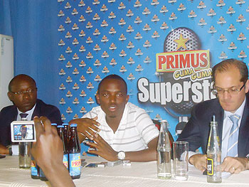 (L-R) Bralirwau2019s  Elvis Castanou, Primus Guma Guma Superstar 2011 Tom Close and Bralirwau2019s Marketing Manager Jan van Velzen at the launch. The New Times/L. Mbabazi.