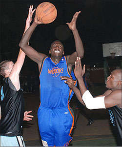 Eric Malinga (centre) is a four-time champion with Ugandan side Falcons. Net photo.