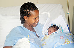 Yvette Umurerwa with her Baby Boy at Hopital La Croix Du Sud yesterday. The New Times / John Mbanda.