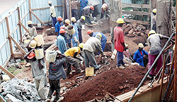 Workers at a construction site. Government intends to formulate a policy to ensure protection of employees at their workplaces. The New Times / File.