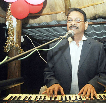 A musician entertains the crowd at The Indian Chef restaurant.