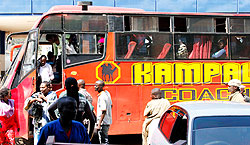 Passengers disembark from a bus from Kampala at Nyabugogo  yesterday. Bus companies cashed in on the festive season. The New Times / T.Kisambira