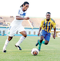 Police FCu2019s Brazilian striker Rivaldo Oliviera tests Amavubiu2019s Niyonshuti Ghaad in a friendly match yesterday at Amahoro stadium. The New Times/T. Kisambira.