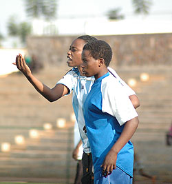 AS Kigali coach Grace Nyinawumuntu passing on tips to her players. AS Kigali lifted their third league title last year. 