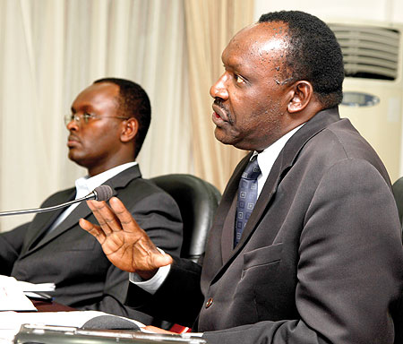 Minister Francois Kanimba speaking at a news conference on Thursday, while the Permanent Secretary in the Ministry of Trade and Industry, Emmanuel Hategeka, looks on. The New Times / T.  Kisambira.