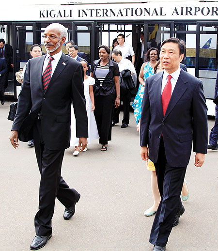 RPF Secretary General, Francois Ngarambe (L), receives Li Yuanchao, a member of the Political Bureau of the Communist Party of China upon the latteru2019s arrival at Kigali International Airport yesterday. The New Times / T. Kisambira.