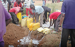 Police and residents destroy hundreds of litres of illicit brew intercepted in the past. The New Times / File.