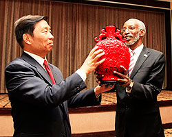 RPF Secretary General Franu00e7ois Ngarambe, (R) receives a traditional Chinese Pot from Li Yuanchao, Member of the Political Bureau of the Communist Party of China, after their meeting at Kigali Serena Hotel yesterday. The New Times / Timothy Kisambira.