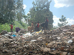 TO BE PHASED OUT; Children forage through a garbage heap at Nyanza landfill in Kigali. The New Times / File.
