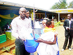 Ndagijimana rewards a mother as for observing antenatal care. The former was sacked for failing to ensure proper hygiene at the hospital. The New Times / File.