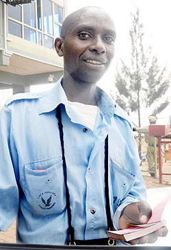 A KVCS employee at work. Motorists have complained about lack of ample parking  space on the streets. The New Times / File.