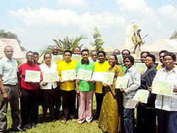 A group of the nurses and midwives pose for a  photo with their certificates. The New Times / Courtesy.