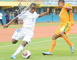 Rusheshangoga takes on an Ivory Coast player during the 2011 CAF U-17 Africa championship. The youngster is set to undergo trials in Belgium. The New Times/ File.