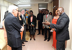 Prime Minister Pierre Damien Habumuremyi (R) welcomes the PSI delegation led by board chairperson Frank Loy (L). The New Times / John Mbanda.