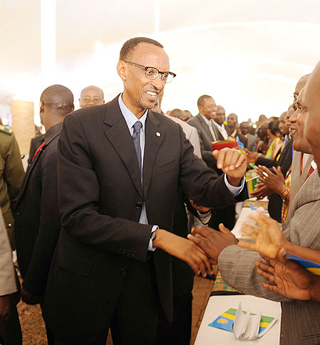 President Kagame greeting members of the Rwandan community in Uganda yesterday. The New Times / Village Urugwiro
