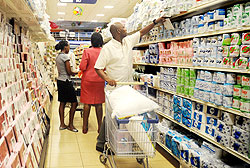 Shoppers in one of Kigaliu2019s retail stores. Supermarket owners have decried the poor quality of local products they are supplied with. The New Times / File