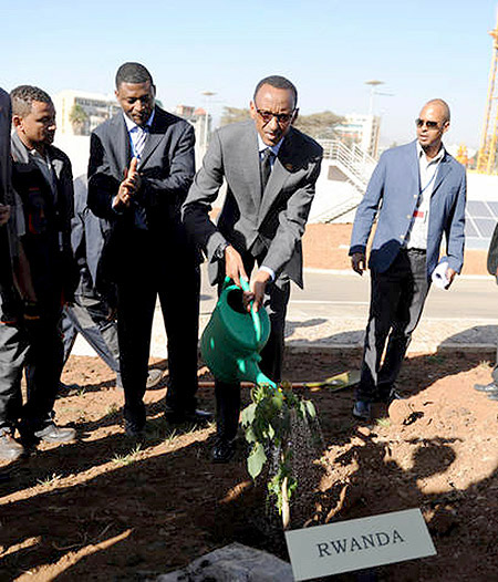 President Kagame waters a tree which he planted in memory of the late Prof. Wangari Maathai, a renowned Kenyan environmentalist, at the newly constructed African Union Conference Centre in Addis Ababa, Ethiopia. The New Times/ Village Urugwiro.