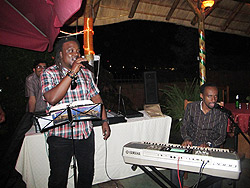 (L) Pianist and music director Didier Kayihura Ntali and Didier Jean Yves Muhawenimana of Kigali Groove Band entertain guests at the event.