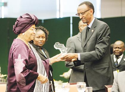 New ALMA Chairperson, Liberia President - Ellen Johnson Sirleaf (L) presents the Malaria  Excellence Award to President Kagame