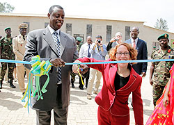 Ms Anne Casper (R) with Defence minister Gen. James Kabarebe cut a ribbon to inaugurate VCT building at Kanombe military Hospital.  