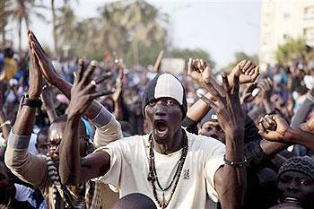 Anti-government demonstrators take to the streets during a protest against Senegal President Abdoulaye Wades decision to seek a third term in the capital Dakar. Net  Photo.