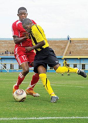 Mukurau2019s left back Patrice Uwimana in a challenge against Etincellesu2019s Thu00e9oneste Gasongo yesterday. Mukura beat Etincelles on penalties to reach the last eight of the Primus Cup. The New Times/T. Kisambira.