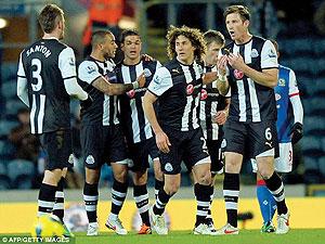Newcastle United celebrate scoring the first goal of the game at Ewood Park. Net photo.