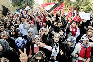 Egyptians chant slogans as thousands march in a protest from Al-Ahly club to the headquarters of the ministry of interior in Cairo on Thursday. Net photo.