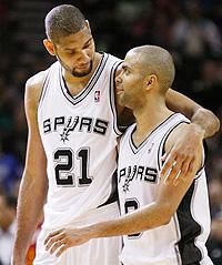 San Antonio Spurs' Tim Duncan, left, and Tony Parker, of France, talk during the second half. (Net photo)
