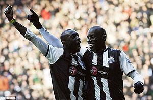 Ba (right) and Cisse celebrate as the two strikers fire Newcastle to victory. Net photo