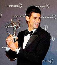 Novak Djokovic poses with his Laureus Sportsman of the Year Award trophy. Net photo