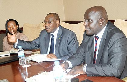 National Bank of Rwanda Governor Claver Gatete (C), his deputy Monique Nsanzabaganwa (L)  and Thomas Kigabo at a press briefing after presenting the Monetary Policy Statement yesterday.