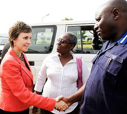 Emmanuel Gasana the IGP welcomes Joanna Kerr, the Chief Executive of Actionaid International on her arrival at Police headquarters yesterday. The New Times / T. Kisambira.