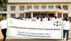 Members of the judiciary matching to mark the corruption week yesterday. The New Times / T. Kisambira.